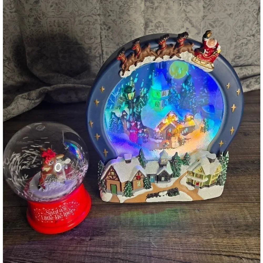 Two snow globes, animated snow, one is musical  and lights up htf